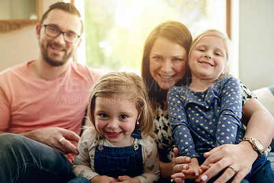 Buy stock photo Hug, portrait and smile of family on sofa in living room of home together for bonding or love. Happy, relax or trust with mother, father and daughter children in apartment for development or security