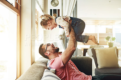 Buy stock photo Airplane, playful and father with daughter on sofa for flying games, bonding and love. Happiness, connection and balance with man and child in living room of family home for trust, growth and care