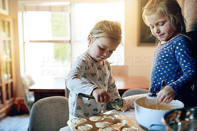 Buy stock photo Baking, muffins and kids in kitchen in home for bonding, connection or learning on weekend. Helping, mixing bowl and girl children with preparing batter in pan for cupcakes or dessert together.