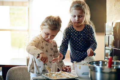 Buy stock photo Baking, development and kitchen with girl kids in home together for learning or growth. Cooking, fun and messy with sister children at counter in apartment for ingredients or recipe as baker family