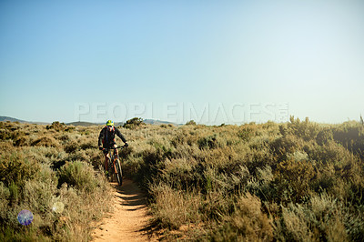 Buy stock photo Nature, trail and athlete cycling with mountain bike for fitness, workout or cardio exercise. Sports, outdoor and cyclist on dirt road path riding with endurance for race, triathlon or competition.