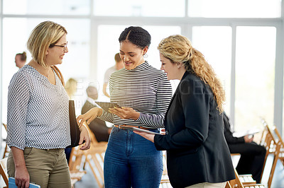 Buy stock photo Business women, tablet and discussion at seminar for planning, insurance review and report. Happy team, conference and conversation with tech at workshop for policy, development or feedback in office