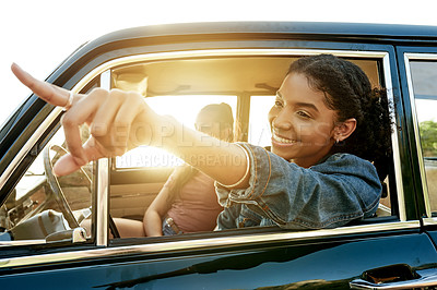 Buy stock photo Pointing, friends and woman with travel in car for road trip view, destination scenery or bonding. Driver, flare or happy people in vehicle for adventure ride, journey pause or sightseeing on holiday