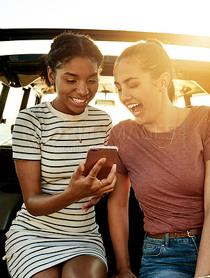 Buy stock photo Road trip, friends and women in car with phone for social media on holiday, vacation and adventure. Travel, online and happy people with smartphone for bonding on journey, destination and getaway