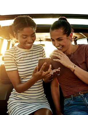 Buy stock photo Road trip, laugh and women in car with phone for social media on holiday, vacation and adventure. Friends, online and happy people with smartphone for bonding on journey, destination and travel