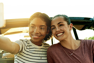 Buy stock photo Happy women, photography and car with selfie for travel, road trip picture or holiday together. Female people, smile and capture moment with vehicle for outdoor memory, social media post or journey