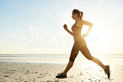 Buy stock photo Sunrise, running and woman at ocean with earphones, workout and commitment to healthy outdoor exercise. Music, training and girl at beach for morning fitness, body wellness and mockup space in nature