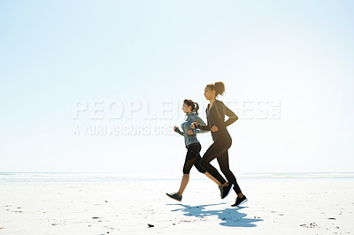 Buy stock photo Fitness, friends and running on beach for training, wellness or cardio exercise with space. Women, runners and challenge at ocean for competitive workout, endurance or marathon practice together