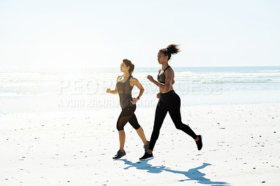 Buy stock photo Exercise, women and running on beach for workout, wellness or cardio fitness with mockup space. Friends, athlete and flare at ocean for competitive training, endurance or marathon practice together