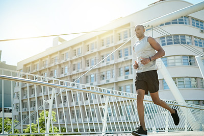 Buy stock photo Running, fitness and health with black man in city for cardio challenge, marathon practice and sports athlete. Workout, training and wellness with runner or person on bridge for race and endurance