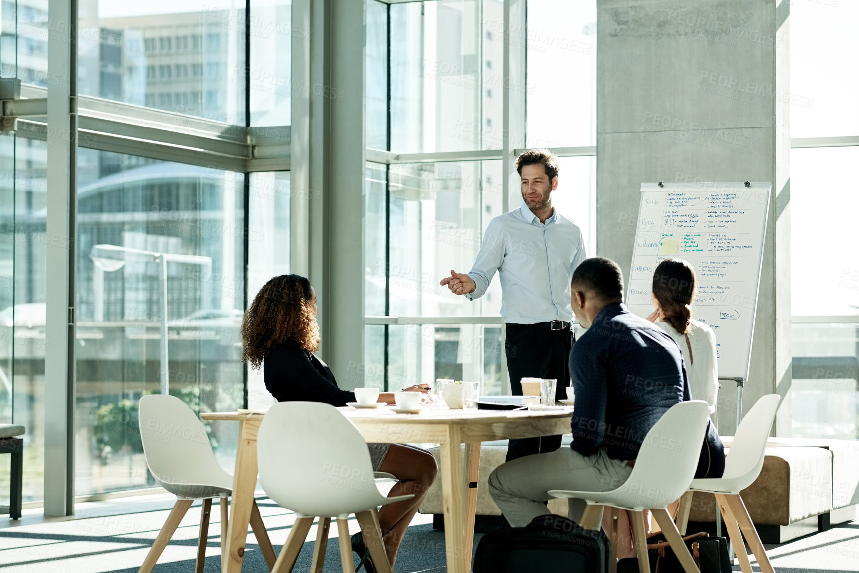 Buy stock photo Presentation, business man and discussion with team for compliance proposal or idea. Presenter, training and planning in office meeting to review policy, strategy or explain feedback for project