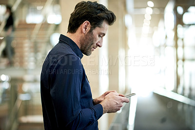 Buy stock photo Business, man or texting with phone in office for email response, work schedule or internet browsing. Professional, employee or smartphone in hallway for mobile chat, online communication or research