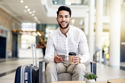 Buy stock photo Portrait, travel and businessman at airport with phone, coffee and flight schedule with bokeh. Smile, mobile and employee at lobby for journey with drink, immigration and waiting for trip to UAE