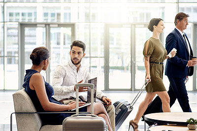 Buy stock photo Laptop, team and meeting with business people in airport lounge for planning, conference trip or research. Luggage, travel and networking event with employees in lobby for conversation and discussion