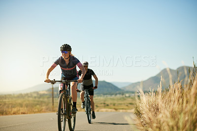 Buy stock photo Exercise, cycling and couple with bike outdoor for sports, fitness and workout together. Bicycle, man and woman on road for training, cardio challenge and travel in countryside with mockup space