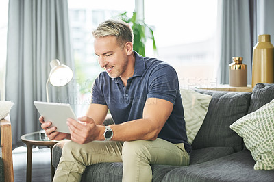Buy stock photo Tablet, streaming and smile with man on sofa for website, connection and watching movie. Film subscription, entertainment and series browsing with person in living room of home for break and app