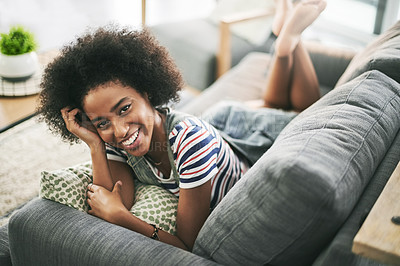Buy stock photo Woman, smile and portrait on couch in house with off day, weekend or rest in living room. Happy, African female person and relax on sofa for break in lounge, stress relief or comfortable in apartment