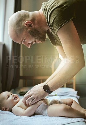 Buy stock photo Diaper change, happy man and baby in nursery, new dad and infant bonding with child care in bedroom at home. Family, love and young father with small kid playing together, smile and laugh at tickling