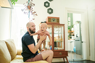 Buy stock photo Baby, father and playing airplane in air on the sofa in a home living room for fun, love and care. Male person or dad with a child for quality time, bonding and happiness while together in the lounge