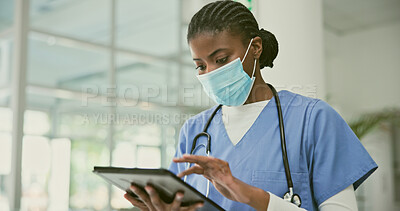 Buy stock photo Tablet, doctor and black woman reading, face mask and typing online healthcare info, medical research or clinic report. Hospital, surgeon and African nurse search database for medicine data analysis