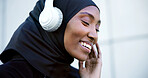 City, fitness and muslim woman with music, listen to radio or streaming song with happiness. Hijab, athlete and black person with headphones for playlist, podcast and smile on audio break outdoor