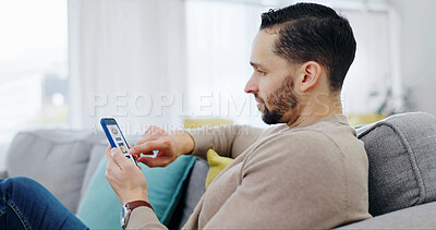 Buy stock photo Man, scroll and phone in home for food delivery, check digital menu and online order on app. Hungry, person and browsing in living room with tech, internet and website with takeaway options.