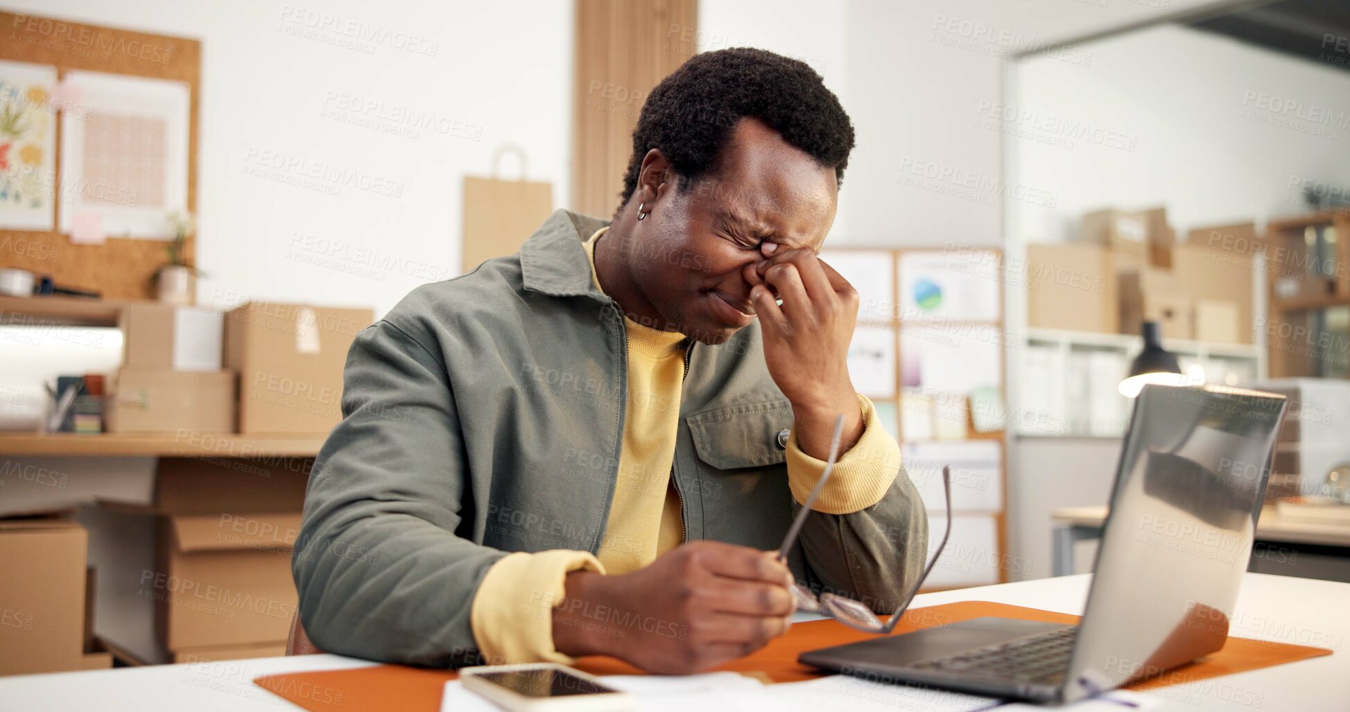 Buy stock photo Laptop, headache or black man with stress in logistics for shipping delay, tax inflation or debt. Male person, employee or migraine with glasses or eye strain for small business bankruptcy or mistake