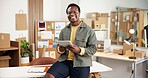 Ecommerce, portrait and black man in office with tablet for erp tech in small business workflow. Smile, boxes and entrepreneur on digital app for online sales data, checklist or inventory management