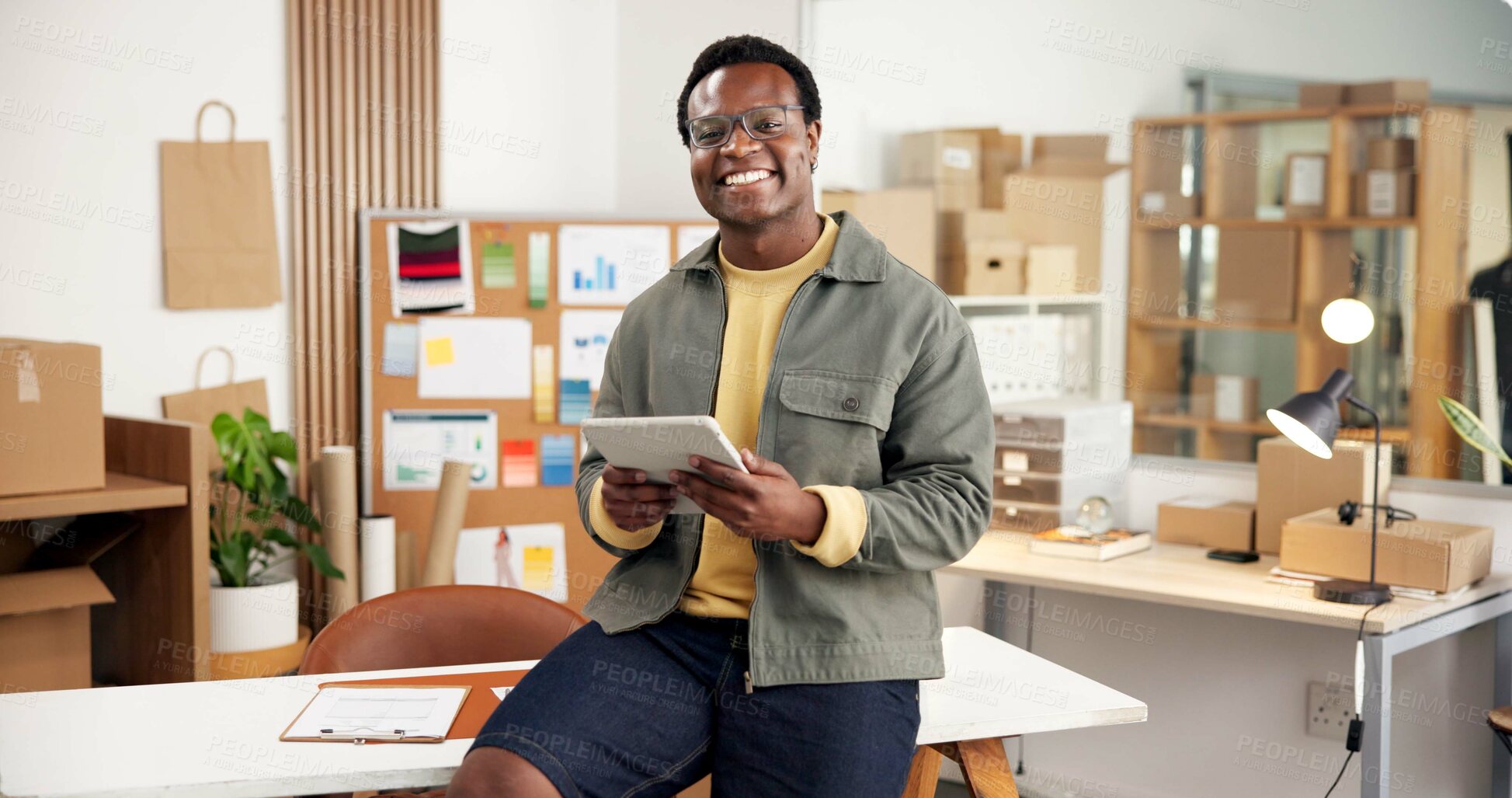 Buy stock photo Ecommerce, portrait and black man in office with tablet for erp tech in small business workflow. Smile, boxes and entrepreneur on digital app for online sales data, checklist or inventory management