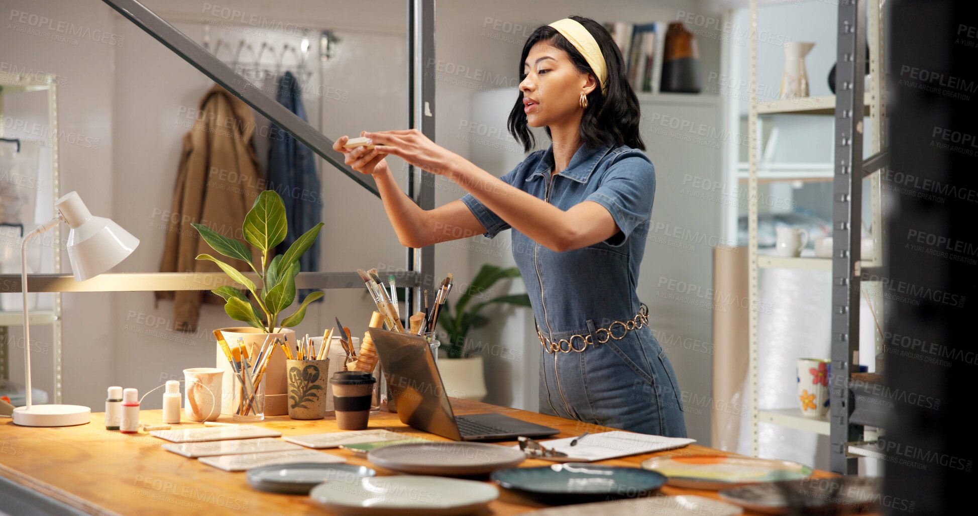 Buy stock photo Pottery, woman and picture in shop with phone, online and social media marketing for small business. Person, clay product and photography in store with tech, content creation and post for art seller.