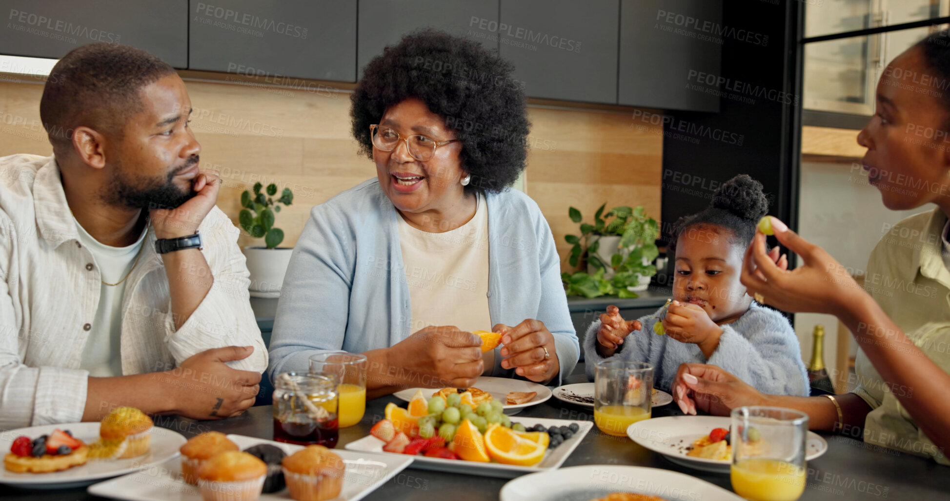 Buy stock photo Happy, kitchen and family with child for breakfast, healthy eating and meal together in morning. Home, food and African girl with parents, grandma and fruit for vitamins, nutrition and wellness