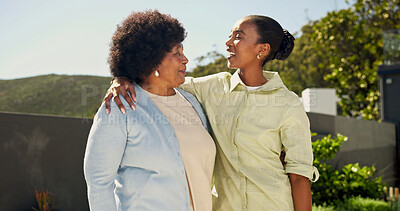 Buy stock photo Hug, outdoor and woman with senior mom in backyard for bonding, connection and happy relationship. Family, talking and black person with embrace, smile and elderly mother for affection, trust or love