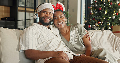 Buy stock photo Christmas, portrait or black couple relaxing in home for festive celebration, comfort or holiday. Happy, man and woman with smile on sofa for December vacation, weekend or bonding together in house