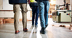 Carpentry, walking and legs of people in workshop for planning, teamwork and timber business. Construction, contractor and workers in warehouse for woodworking, lumber production and manufacturing