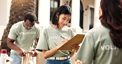 Buy stock photo Checklist, volunteer or woman writing with clipboard for outreach, donation or charity campaign. Female person, activist or community service with notes for NGO project or outdoor fundraiser together