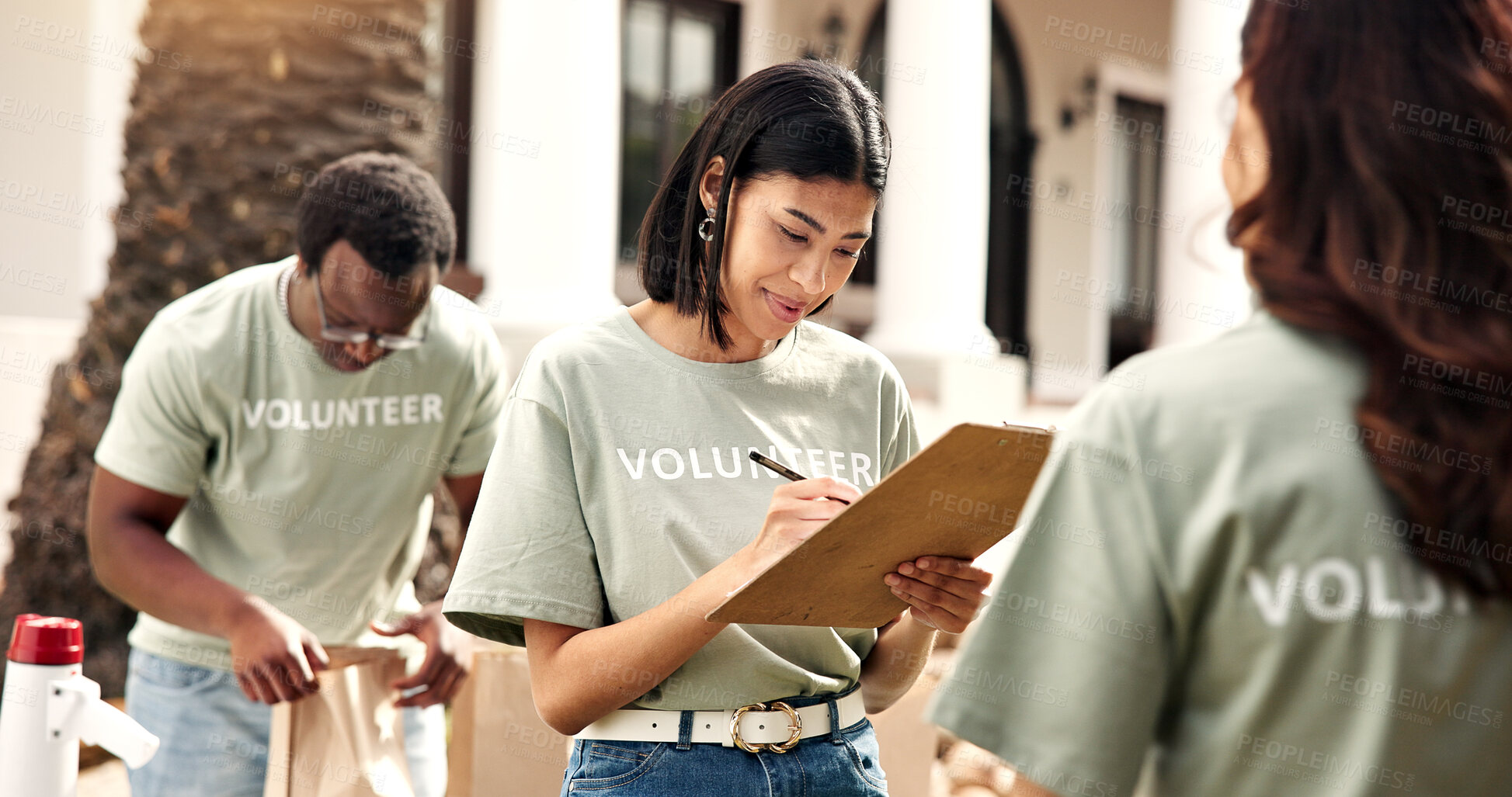 Buy stock photo Checklist, volunteer or woman writing with clipboard for outreach, donation or charity campaign. Female person, activist or community service with notes for NGO project or outdoor fundraiser together
