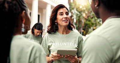 Buy stock photo Volunteer, team leader and tablet outdoor for planning event, task delegation and charity agenda. NGO, happy mature woman and tech for group coordination, fundraising schedule and outreach management