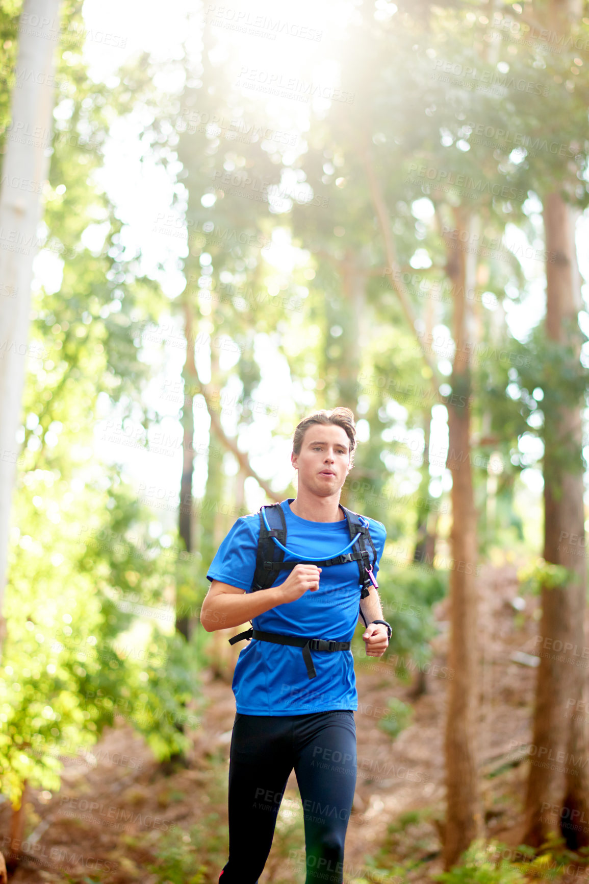Buy stock photo Fitness, man and running in forest with workout for marathon competition, endurance challenge and cardio. Trail runner, athlete and breathing exercise in woods for training performance and wellness