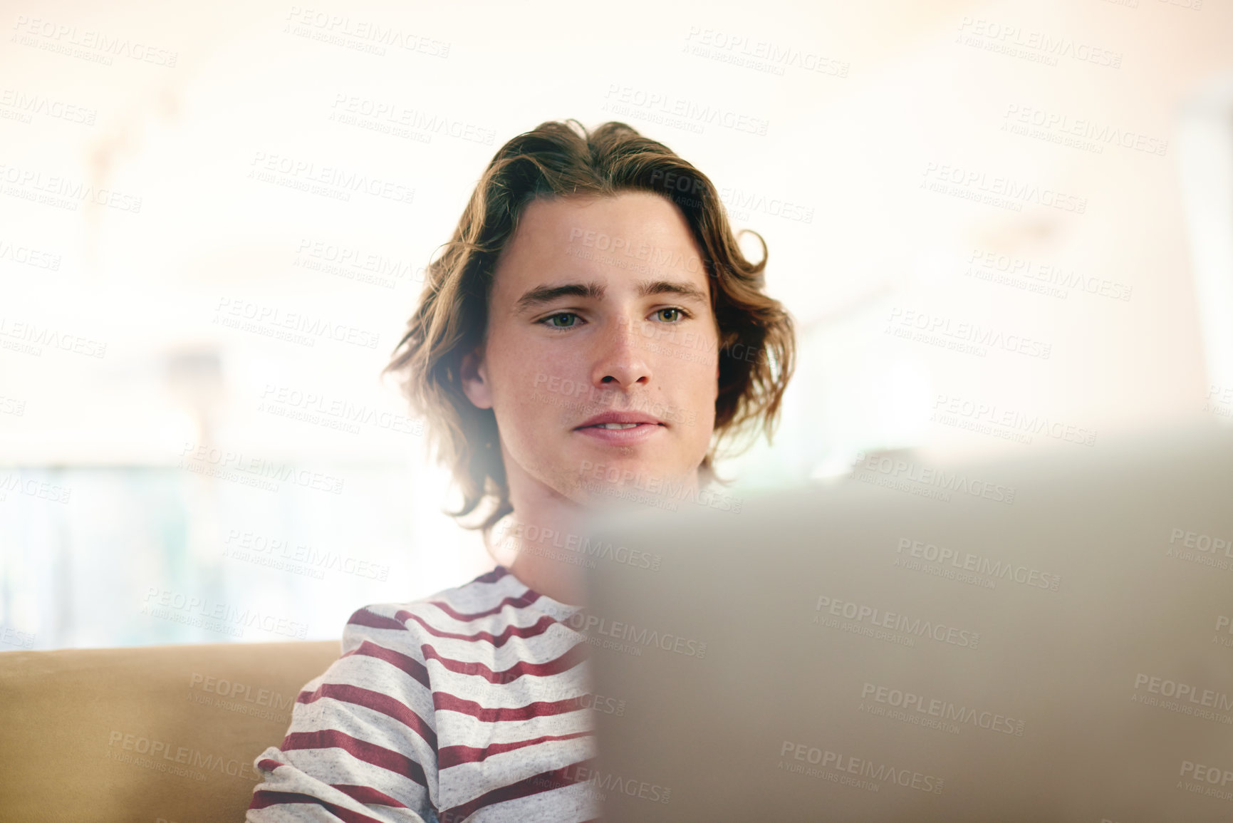 Buy stock photo Man, laptop and relax on sofa with search for movies, streaming or post on web at apartment. Person, computer and scroll on couch, film subscription or video on social network in living room at house