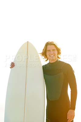 Buy stock photo Happy, surfboard and portrait of man by beach for surfing hobby, water sports and outdoor adventure. Flare, space and person by sea, ocean and sunshine for vacation, holiday and weekend in Australia