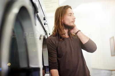 Buy stock photo Convenience, thinking and waiting with man in laundromat for chores, cleaning or hygiene. Idea, laundry or service and client at dry cleaners with washing machine for household responsibility