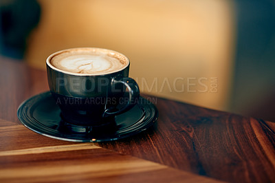Buy stock photo Cafeteria, foam and coffee cup on table for serving caffeine beverage, warm drink and cappuccino. Hospitality, small business and mug on counter for restaurant, diner and service for aesthetic