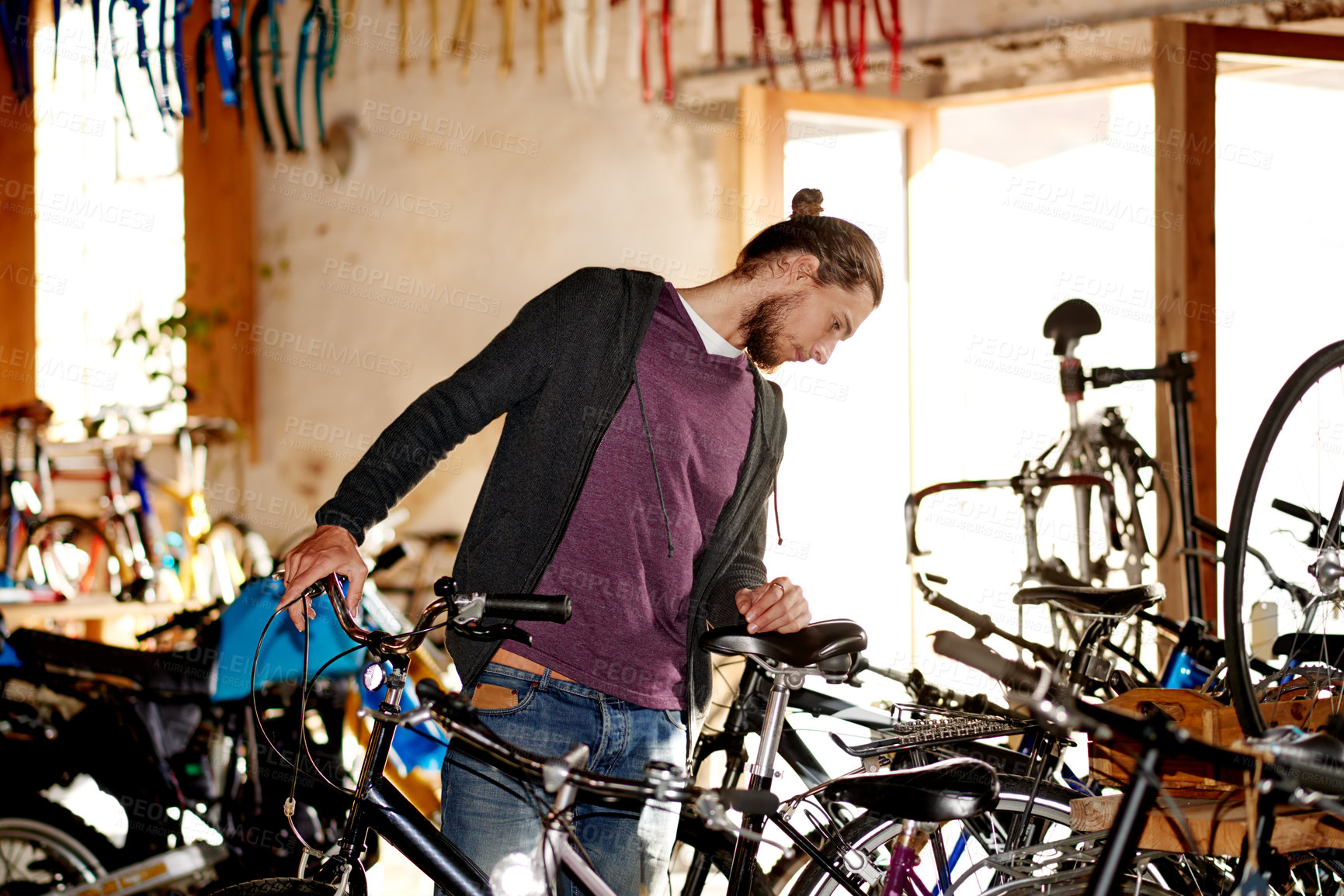 Buy stock photo Business, bike and man in store, repair and fix with skills, technician or eco friendly travel. Shop owner, entrepreneur or employee in workshop, merchandise or cyclist with maintenance or inspection