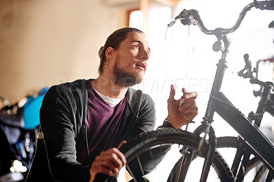 Buy stock photo Man, bike and repair brakes at garage with cable inspection, maintenance and services at workshop. Person, bicycle and safety check with wheel, tyres and gear with restoration job at small business