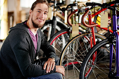 Buy stock photo Bicycle, happy and portrait of man in store for fixing, repair and selling bike equipment. Startup, workshop and confident person with smile for maintenance, cyclist technician and mechanic business