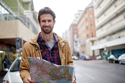 Buy stock photo Portrait, man and map for travel in city for direction, location search and information for tourism. Male person, chart document and urban layout of commute guide, street navigation and journey route