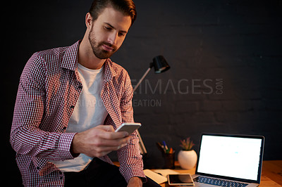 Buy stock photo Business, night and man in office, cellphone and laptop with mockup space, freelancer and social media. Evening, copywriting and person in workplace, smartphone and message to contact and connection