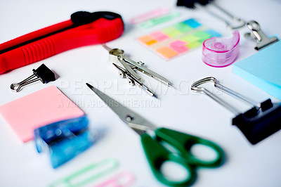 Buy stock photo Creative, flat lay and stationery on desk of workstation, ready for business planning or design. Compass, scissors and sticky notes on table in empty office for productivity process from above