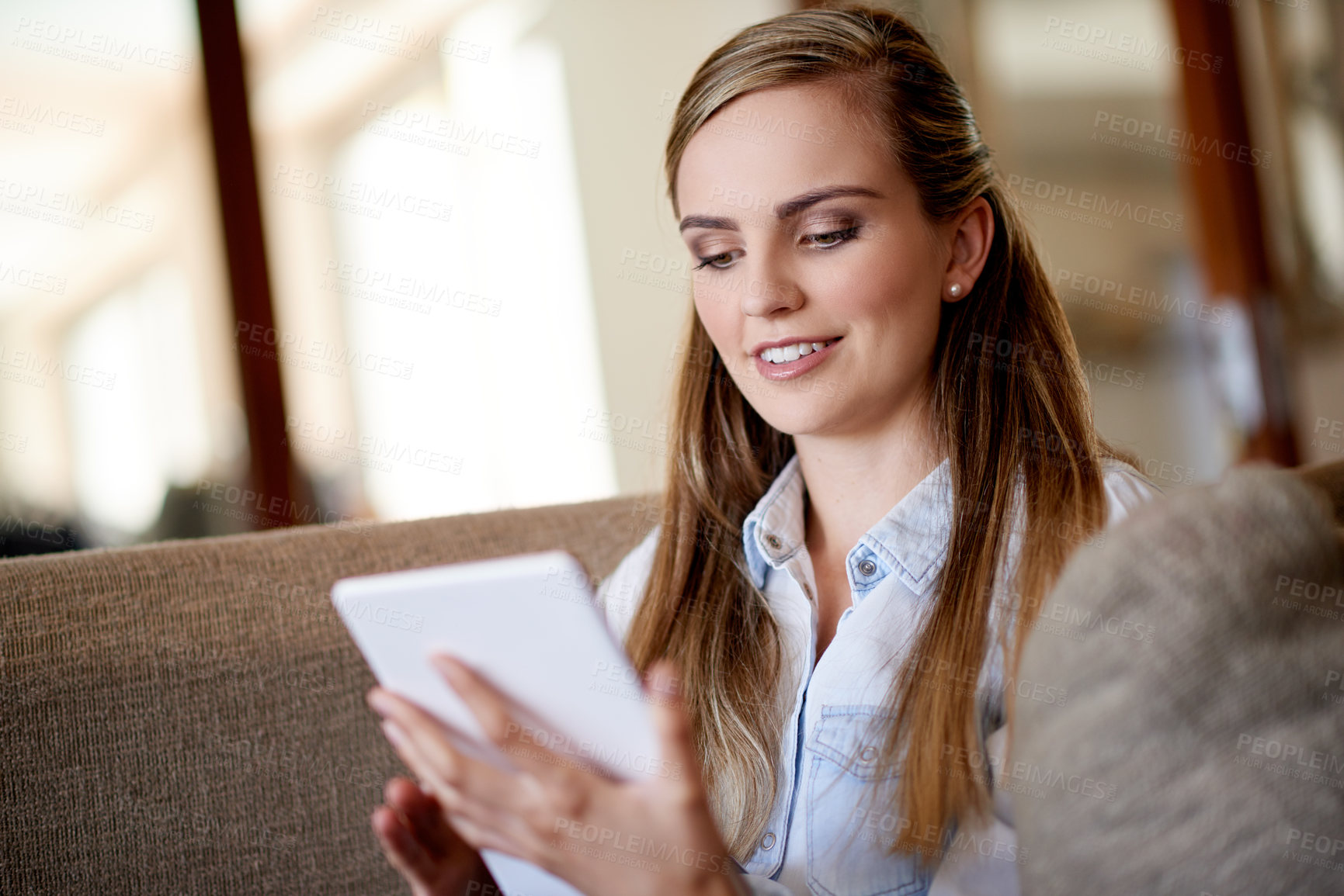 Buy stock photo Home, relax and woman with tablet, typing and online reading with subscription, chatting and email. Happy, tech and person on sofa, digital app and message to contact, social media or communication