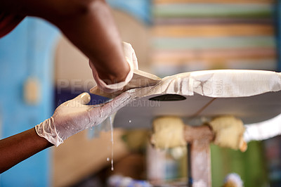 Buy stock photo Surfboard, plastic and man with glue in workshop for manufacturing, production and customization. Craft, small business and person with equipment for repairs, maintenance and renovation in factory